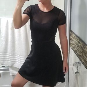 Fun little black skater dress with mesh